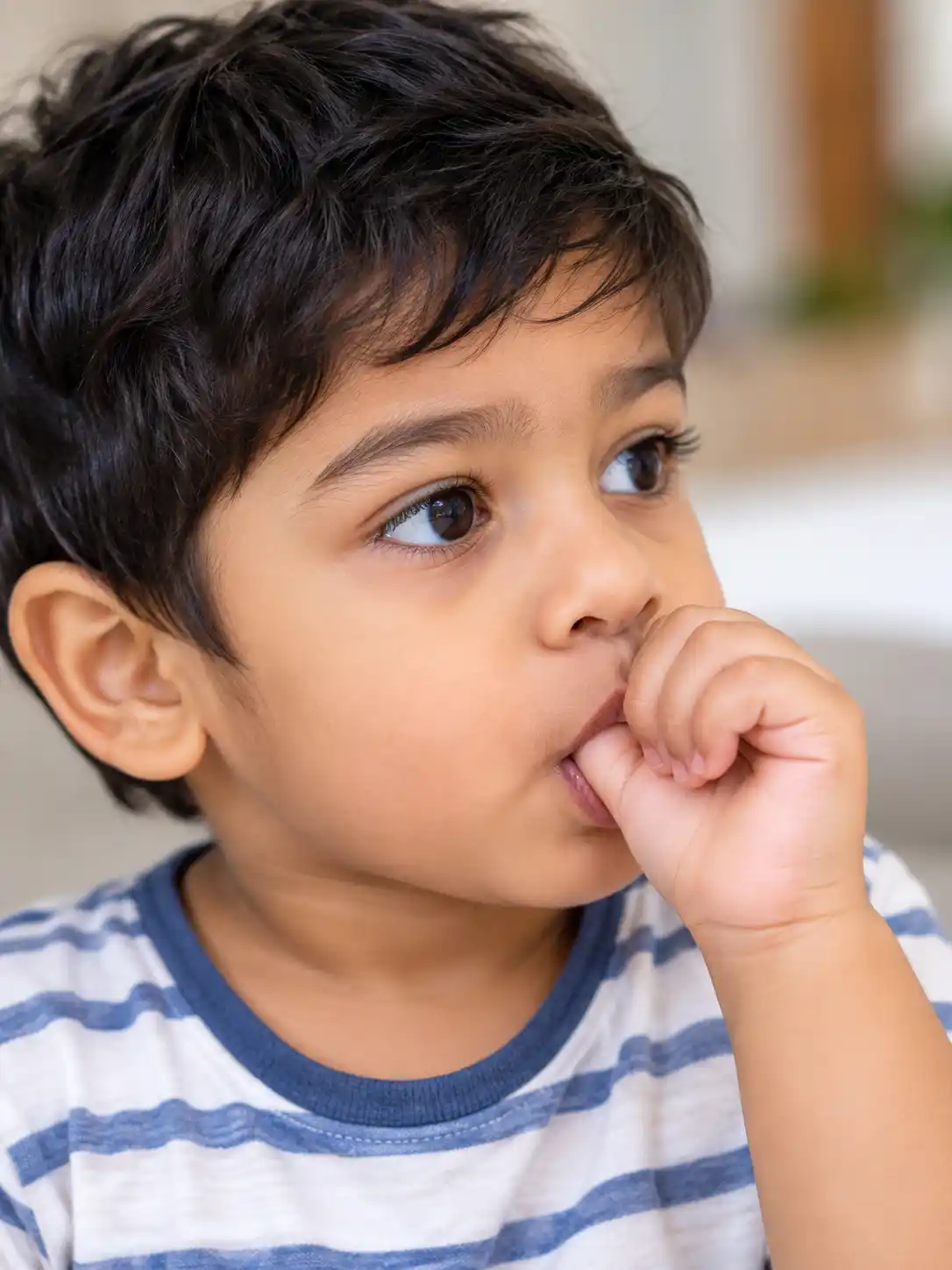 a image showing child sucking thumb